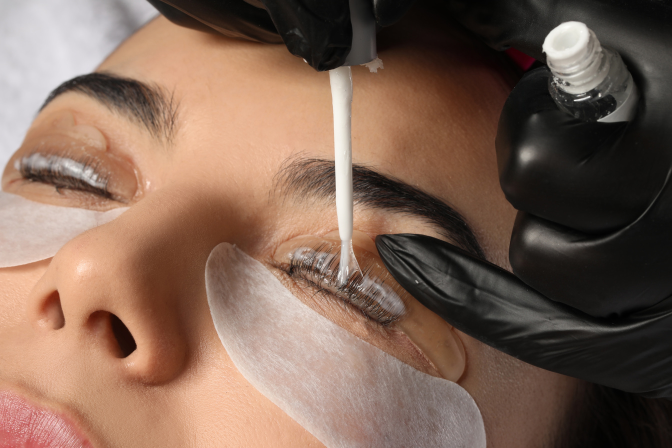 Young Woman Undergoing Eyelash Lamination, Closeup. Professional
